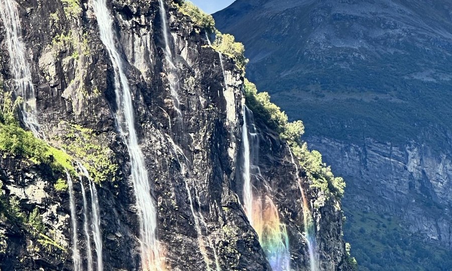 Waterfalls and rainbow in a Norwegian landscape
